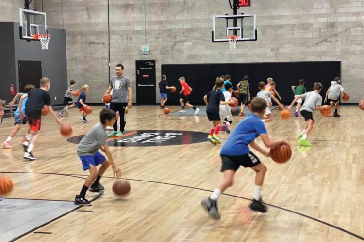 Kids practicing basketball