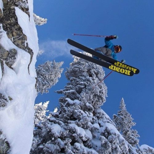 Skier jumping over head with Romp Skis