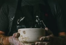 Chef Alex Seidel holding ceramic bowl