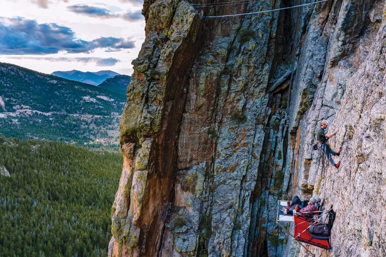 Rock climbers camping on cliff face