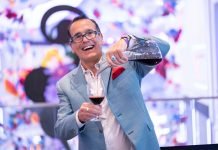 Vendor pouring wine out of decanter