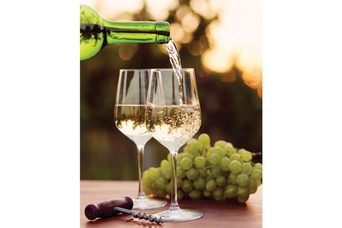 Wine being poured in glasses