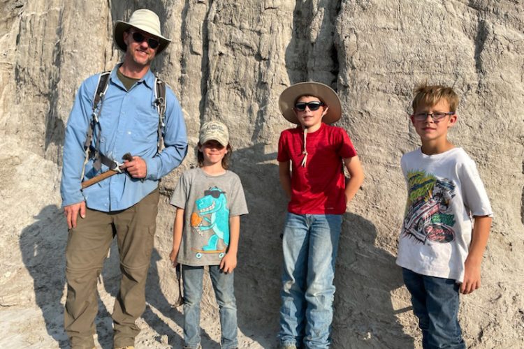 Dr. Tyler Lyson, lead scientist of the project, and the trio of young fossil finders, Liam Fisher, Jessin Fisher, and Kaiden Madsen who discovered the remains of a juvenile T. rex skeleton while out looking for fossils with their dad Sam Fisher