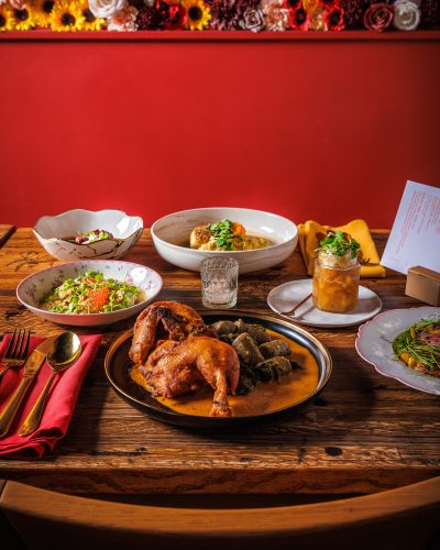 Clockwise from top: Fish Kiev, Layered Kissel, Tomato “Kholedets,” Chicken Paprikash, Corn + Crab Varenyky, and Beet and Plum Borscht