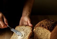 Buttering a slice of bread