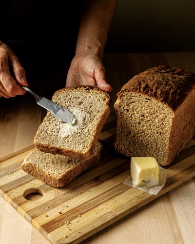 Buttering a slice of bread