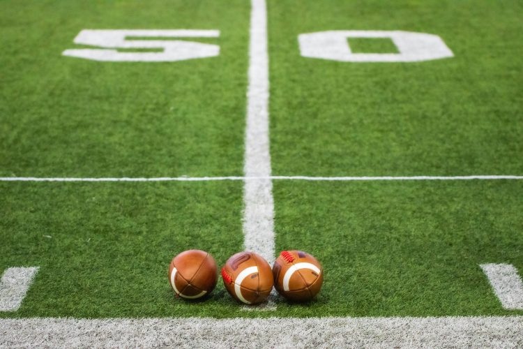 Footballs on 50 yard line
