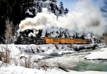 Cascade Canyon Winter Train runs through the mountains along the river.