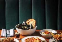 Selection of dishes from Jacques including mussels, beets, fries, beef tartare, steak, chicken liver pâté, and two mini espresso martinis