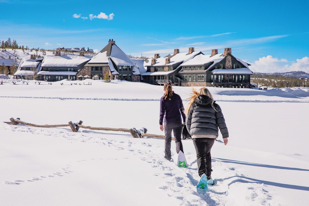 Two women snowshoe at Devil's Thumb Ranch.