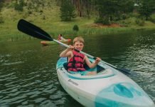 Child kayaking at Camp Shady Brook.