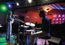 Man plays drums at MAS Presents.