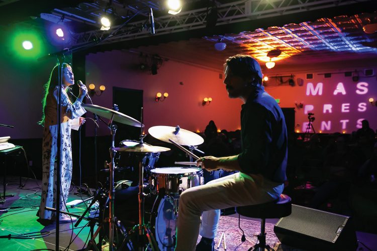 Man plays drums at MAS Presents.