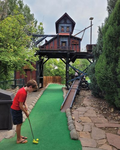 People golfing at Colorado Journey Mini Golf.