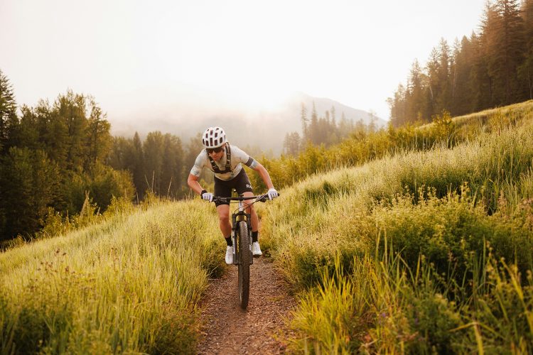 Person mountain biking.