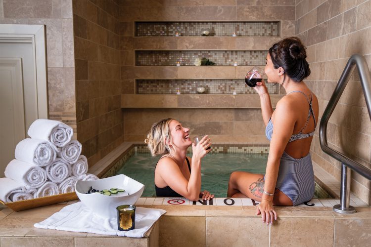 Women soak in a hot tub at the Ritz-Carlton Spa, Denver.