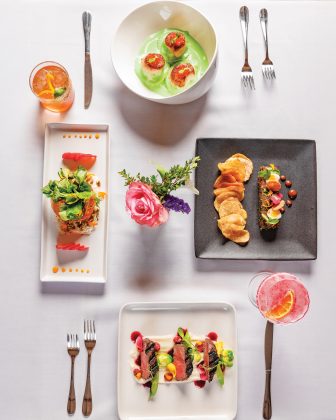 Hokkaido seared sea scallops and mushroom ravioli, filet mignon tartare, seasonal mocktail, peppermint-grilled elk loin, spring strawberry watercress salad, and a smoked out margarita from Evoke 1923.