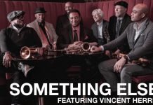 The seven members of Something Else! sitting with their instruments