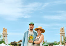 Meet the Power Couple of Produce Margo and Peter Wanberg pose at a farmers market.