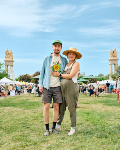 Margo and Peter Wanberg pose at a farmers market.