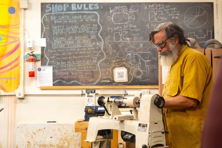 Man teaches woodworking class