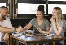 People share a meal at the City of Aurora