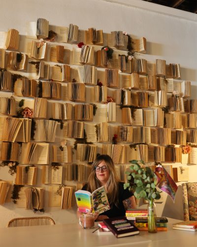 Dylah Ray reads a book at Petals and Pages.