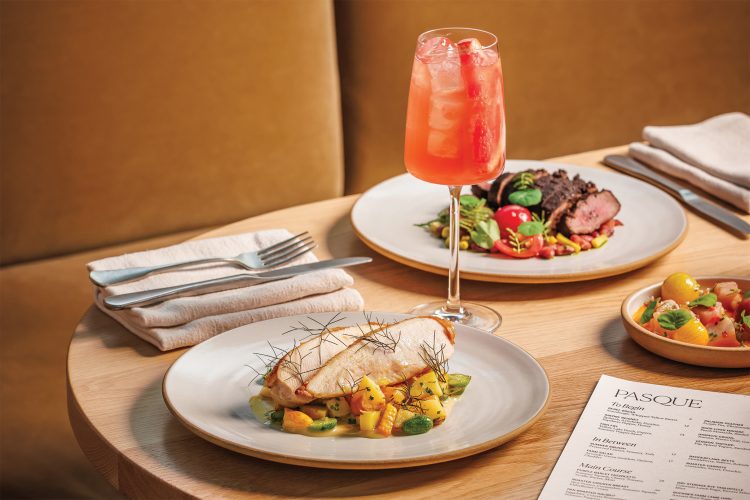 The roasted chicken, Better Weather cocktail, and Buckner Farm lamb loin dishes at Pasque.