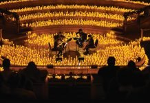 A band plays surrounded by candles at a Candlelight concert.