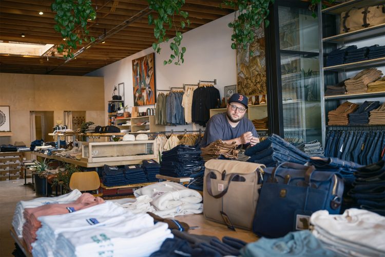 Eli Cox sits inside Berkeley Supply
