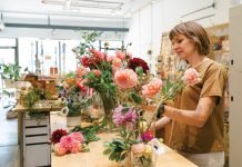 Kimberly Hyde arranges florals at Beet and Yarrow.