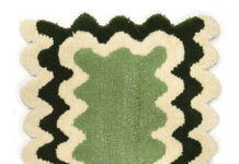 Crafting for a Cause Green and white wavy rug made by a student at Tuft Love's classes.