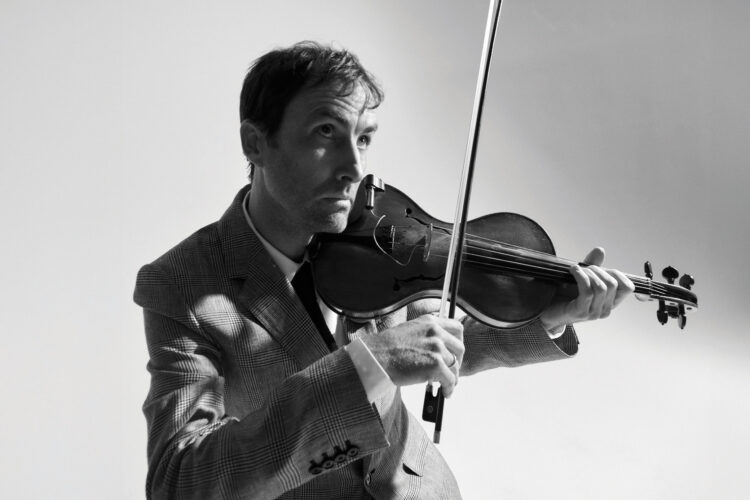 Andrew Bird playing violin. 