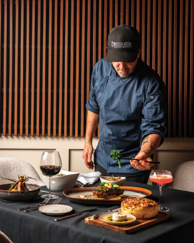 Chef Rand G. Packer prepares dishes at La Rocca Rossa.