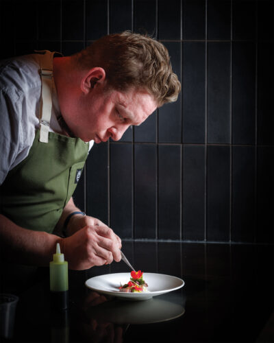 Chef Justin plating tuna crudo.