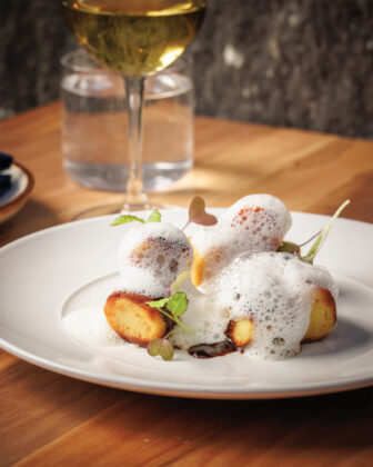 The Parisian gnocchi with mushroom duxelles, black garlic jus, and parmesan.