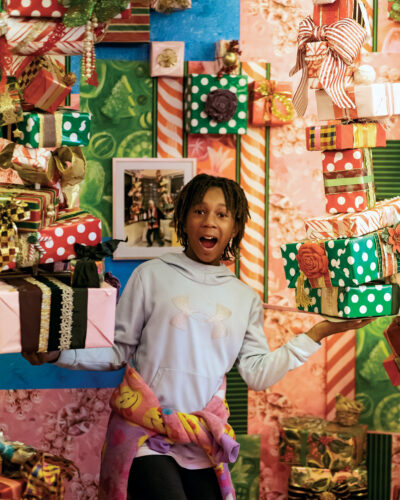 A child excitedly explores Camp Christmas.