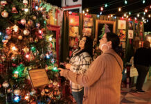 People marvel at the Camp Christmas display.