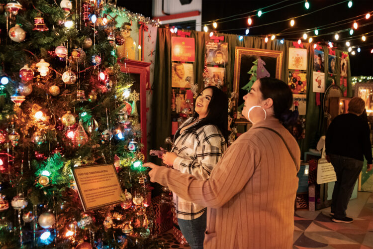 People marvel at the Camp Christmas display.