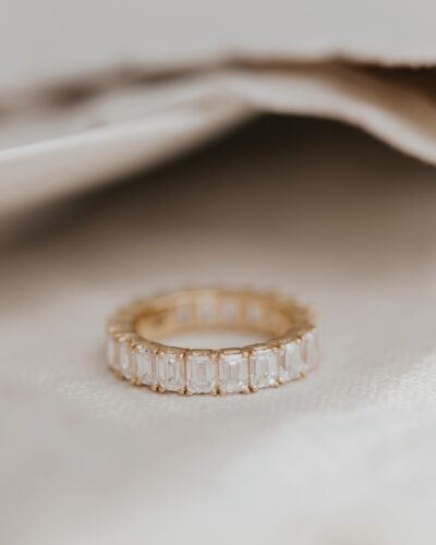 The Amara Emerald Cut Eternity Band from Sarah O. Jewelry.
