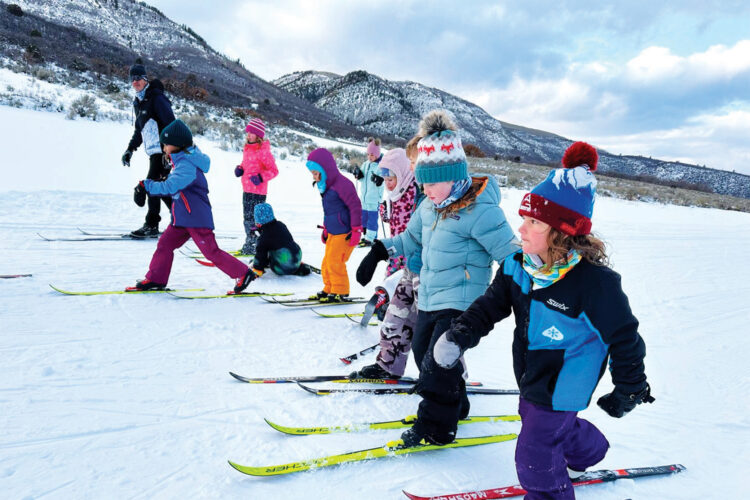 Kids ski with an instructor at AVSC