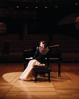 Bob Mackie rare vintage black wool crepe jacket with hand-sewn Swarovski crystals, micro seed beads and sequins, price upon request; Vintage satin champagne ball skirt, price upon request; “Latis” lab-grown diamond drop earrings by Noam Carver Fine Jewelry, $4,400, available at Trice Jewelers, 6885 S. University Blvd., Centennial, tricejewelers.com.