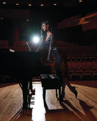 Ariana Dress in paillette-embellished mesh, $1,695, available at St. John, 224 Steele St., stjohnknits.com; Designer vintage earrings with pearl drop, $680, available at Cocotay Vintage Jewelry, @cocotayjewelry.