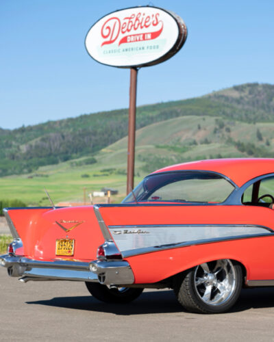 Exterior shot of Debbie's Drive In with a vintage car.