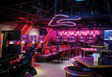 RiNo’s F1 Arcade Bar Serves Racing Thrills and Local Flavor The neon glowing interior of F1 Arcade Bar.