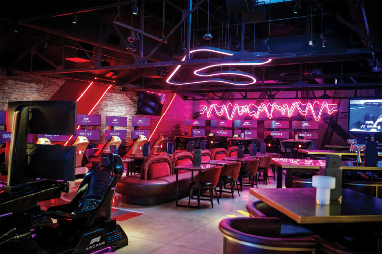 The neon glowing interior of F1 Arcade Bar. 
