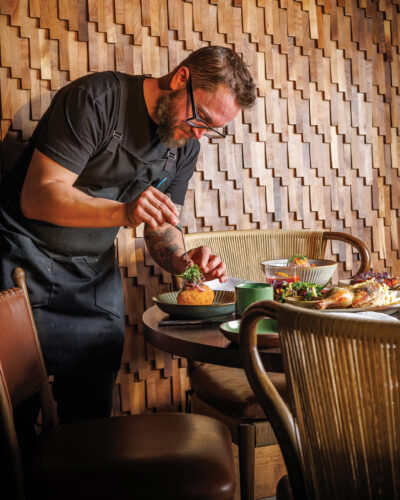 Chef Geoff Cox garnishing the papa rellena.