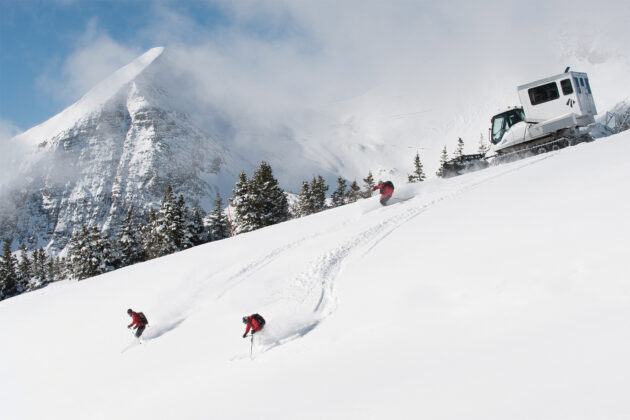 People cat skiing at Eleven Scarp Ridge Lodge.