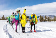 A Guide to Colorado’s Can’t Miss Spring Ski Events Participants at BrewSki dressed in costumes including bananas and 80s workout gear.
