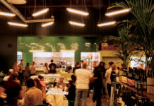 Interior with patrons eating at Molino Chido.